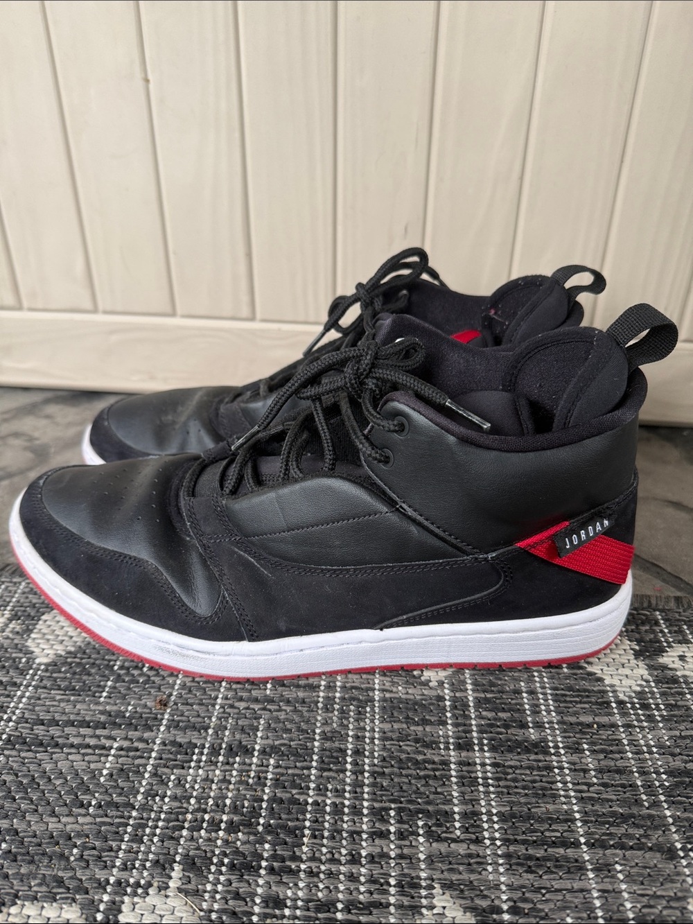 Jordan Men’s Black with Red Accents Mid-Top Sneakers